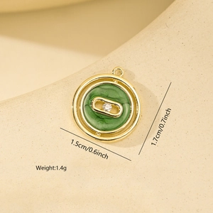 Detailed view of round green enamel pendant with dimensions 1.5cm by 1.7cm for DIY jewelry
