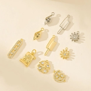 Macro view of geometric zircon pendants for handmade jewelry in gold and silver finish