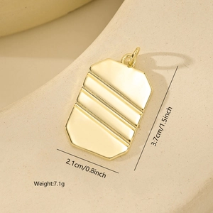 Close-up of 18K gold plated rectangular pendant with diagonal grooves and size details