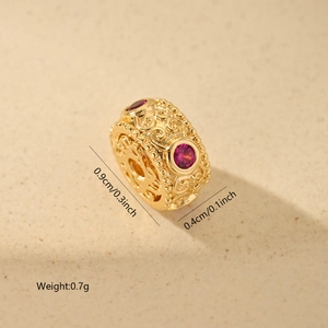 Macro view of gold hollow cylinder bead with rose red zircon and 0.9cm size detail