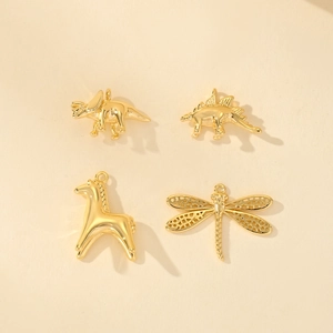 Golden animal charms including dinosaur, horse, and dragonfly for DIY jewelry making