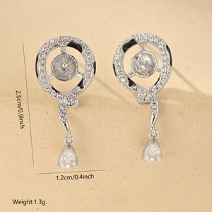 Detail of silver earring components showing 2.5cm size and cubic zirconia stones