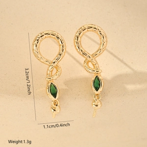Detailed view of golden snake earrings with green zircon eyes and precise measurements