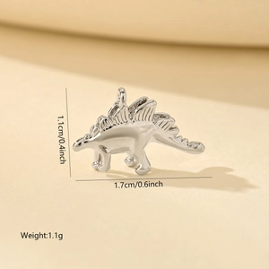 Macro shot of silver stegosaurus charm with dimensions 1.1cm by 1.7cm for DIY jewelry