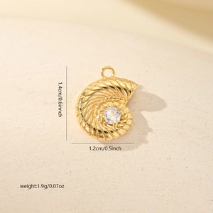 Macro shot of gold nautilus shell pendant with zircon and 1.4cm size measurements