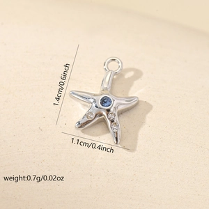 Detailed size view of silver starfish pendant with blue zircon and exact measurements