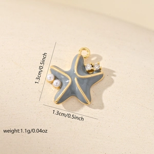 Macro detail of starfish pendant with grey enamel, pearls and dimensions data