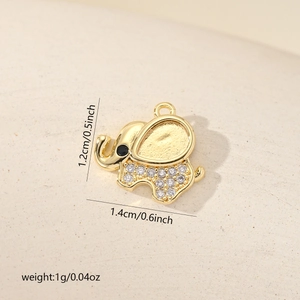 Macro view of gold-plated elephant pendant with zircons, measuring 1.4cm by 1.2cm