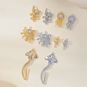 Marine life jewelry charms set with cubic zirconia in gold and silver finishes