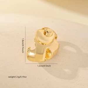 Detailed view of gold copper seashell pendant with dimensions 1.8cm by 1.2cm