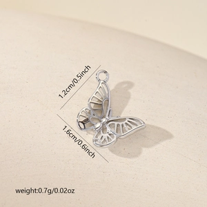 Detailed view of silver butterfly pendant with hollow design measuring 1.2cm by 1.6cm