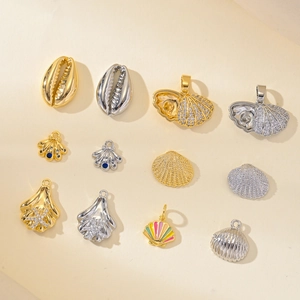 Marine life pendants set with sea shells and stars featuring gold and silver plating