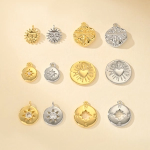 Macro detail of 12-piece mixed gold and silver 3D animal and star charm jewelry pendants