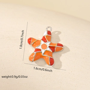 Close-up of a colorful enamel starfish pendant with dimension labels and sand texture
