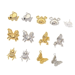 Golden and silver animal charms for DIY jewelry making including elephants and butterflies