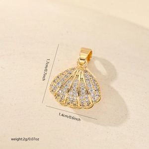 Detailed size view of a gold shell pendant with cubic zirconia for jewelry making