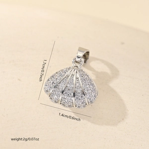 Macro shot of seashell pendant with cubic zirconia, height 1.7cm and width 1.4cm