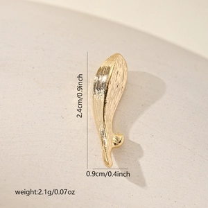 Detailed view of golden koi fish charm with brushed metal texture and size dimensions