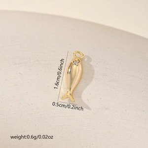 Macro shot of a gold-plated koi fish pendant with cubic zirconia and size dimensions