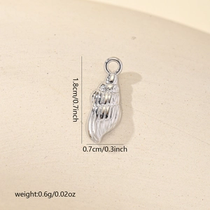 Detailed view of silver seashell pendant with dimensions 1.8cm x 0.7cm and weight 0.6g