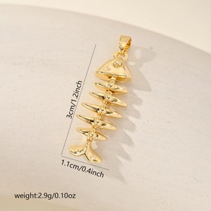 Close-up of gold-plated fishbone pendant with precise dimensions 3cm by 1.1cm