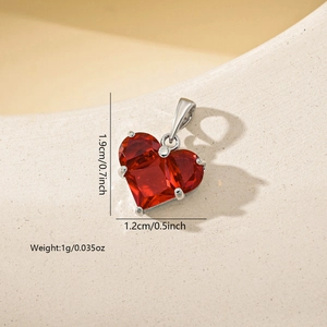 Macro view of heart-shaped red zircon pendant showing 1.9cm height and 1.2cm width