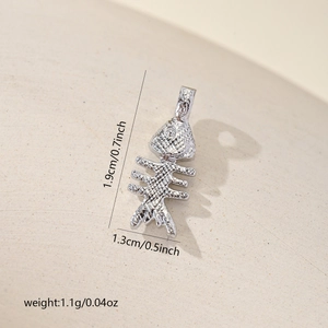 Detailed view of silver fishbone pendant with 1.9cm height and 1.3cm width measurements
