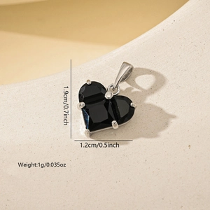 Detail view of a black heart zircon pendant showing dimensions of 1.9cm height and 1.2cm width