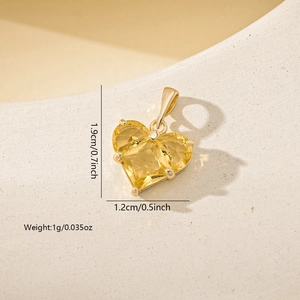 Detail showing a yellow heart zircon pendant with gold finish, 1.9cm height dimensions
