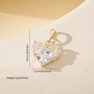 Macro detail of gold-plated heart pendant with zircon showing 1.9cm height measurements