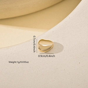 Detailed view of an irregular gold heart bead with size markings for DIY jewelry making