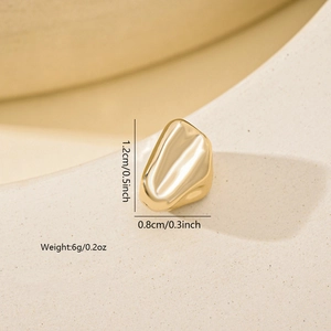 Detailed view of irregular gold spacer bead with size dimensions 1.2cm by 0.8cm and weight info