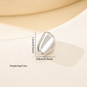 Macro shot of irregular silver spacer bead with dimensions 1.2cm x 0.8cm and mirror finish