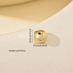 Macro detail of a 0.7cm irregular gold plated bead for DIY jewelry making and crafts