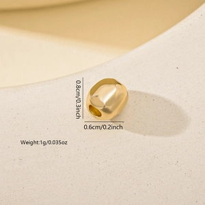 Detailed view of a gold plated irregular metal bead for DIY jewelry making with dimensions