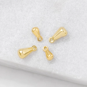 Set van vier gouden waterdruppel hangers voor DIY sieraden met gepolijst metaal