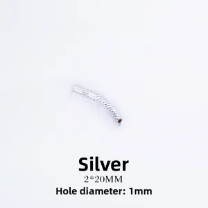 Close-up of silver-plated 2x20mm curved tube bead with textured diamond pattern for jewelry