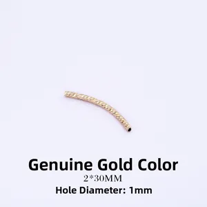 Macro view of a 2x30mm real gold plated curved tube with diamond-cut texture for DIY jewelry