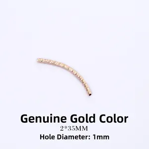Macro shot of 2x35mm gold-plated faceted curved tube beads with 1mm hole for DIY jewelry