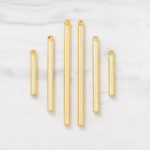 Polished gold cylindrical metal charms in various sizes for DIY jewelry necklace making