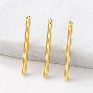 Three minimalist gold plated cylindrical metal pendants for DIY jewelry crafting accessories