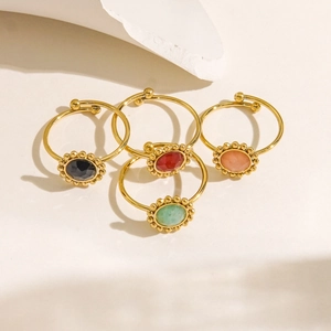 Set of four gold stainless steel adjustable rings with colorful oval gemstones