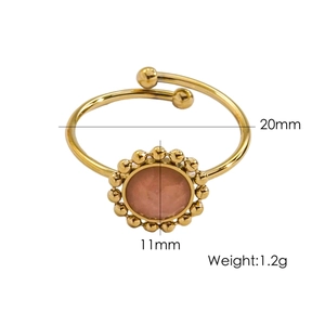 Detail view of adjustable gold ring featuring a 11mm pink stone and size measurements