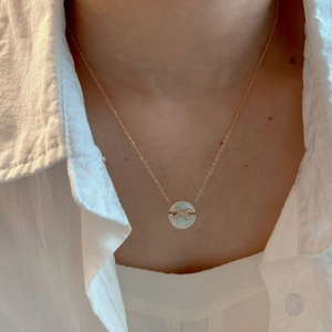 Colorful natural stone necklace with shell diamond pendant shown on model