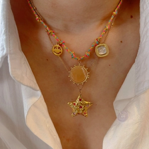 Layered colorful braided cord necklace with gold star pendant and smiley face charm