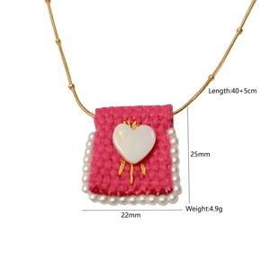 Detail view of handmade necklace showing dimensions 25x22mm and pearl heart pendant