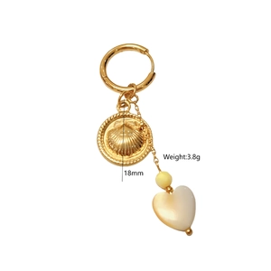 Detailed view of 18mm shell charm earring in gold finish weighing 3.8 grams