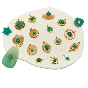Golden bohemian style charms with green natural stone in various celestial and geometric shapes