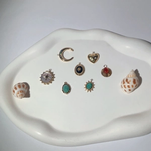 Set of gold-plated natural stone pendants including crescent, heart, and star designs