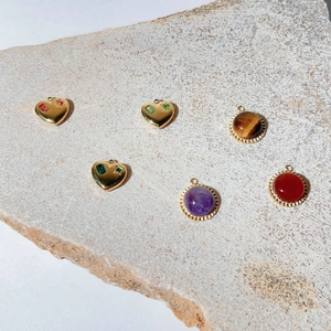 Set of gold stainless steel heart and round pendants with natural stones and crystals